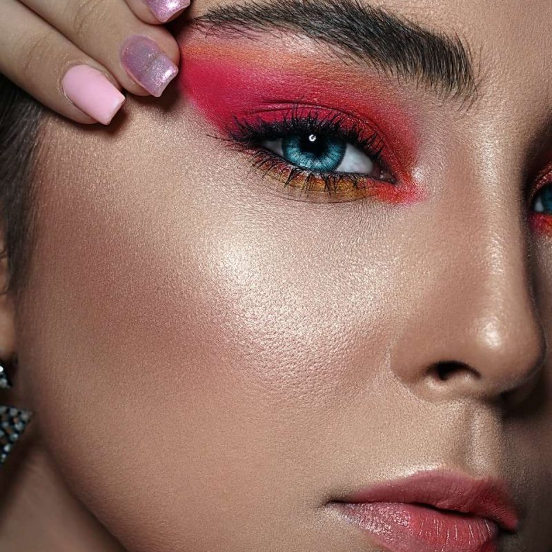 woman with pink lipstick and silver ring